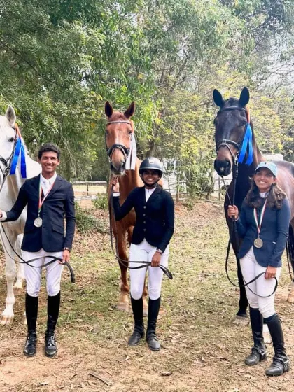 My riders celebrating their success in the NEC Dressage Freestyle event. Their podium finishes, including a silver medal on a borrowed horse with only four days of practice, show their adaptability and skill.