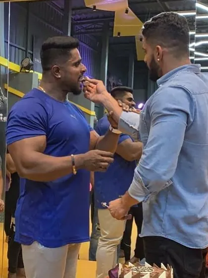 A moment of celebration with my uncle at the gym. The bond we share is the foundation of the community we've built at Kitty's Muscle Planet.