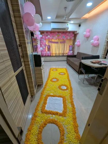 A long view of the traditional flower 'paaypudi' or footprint runner, a beautiful custom for welcoming a new baby into the home.