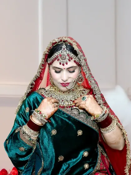 A candid moment of the bride adjusting her necklace. These small, natural gestures often make for the most beautiful and authentic photographs.