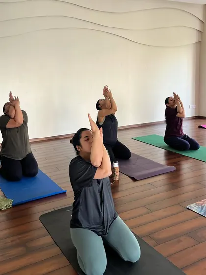Here, we are practicing the arm variation of Gomukhasana, or Cow Face Pose. This is a fantastic shoulder stretch that helps to relieve the upper back and neck tension that often accompanies pregnancy.