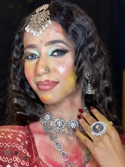 A close-up of a glamorous Holi-inspired look, with smudges of color that still look artistic and intentional.