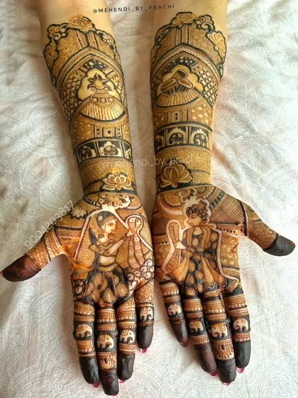 This is what full bridal mehndi is all about: telling a story. I created custom bride and groom figures on the palms, surrounded by intricate patterns and rows of elephants, to capture the essence of their wedding day.