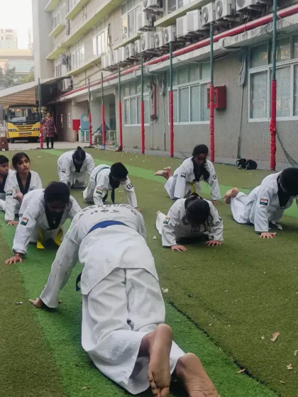 Another angle of our push-up drill. I ensure every student maintains proper form to get the maximum benefit from the exercise.