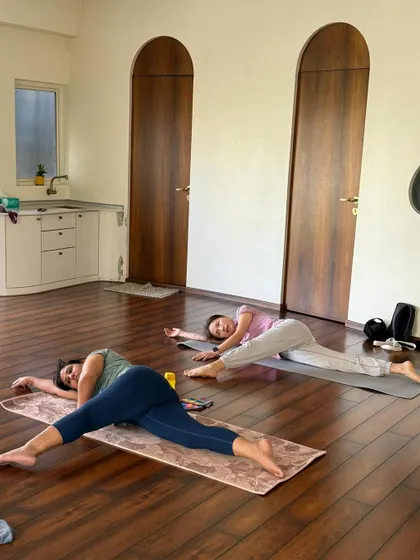 This side-lying stretch is a gentle yet effective way to open the hips and release the lower back.