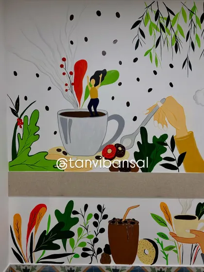 A close-up of the left side of the mural, featuring a character joyfully jumping in a coffee cup. The artwork is full of playful energy.