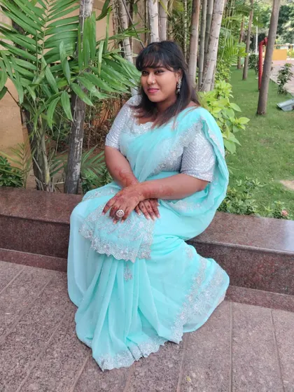 A serene pose in the beautiful light blue saree. The intricate silver work on the blouse and border made it feel truly special.