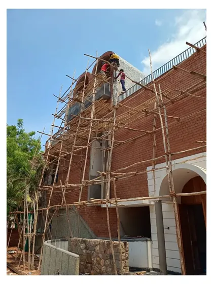 An update from the site as we raced to complete the exterior before the monsoons. The exposed brick facade and China mosaic edging on the roof are nearing completion, showcasing the building's signature materials.