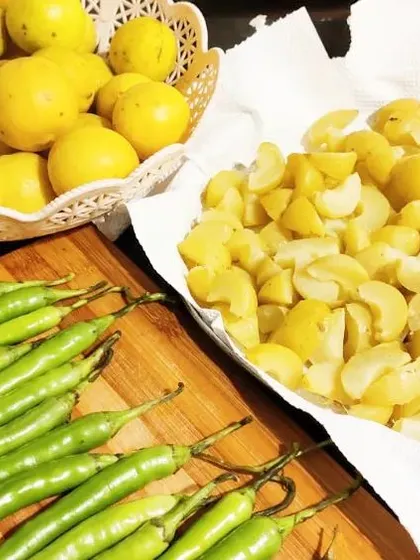 Preparing a batch of our amla, lemon, and chilli pickle. It's a colourful and healthy mix.
