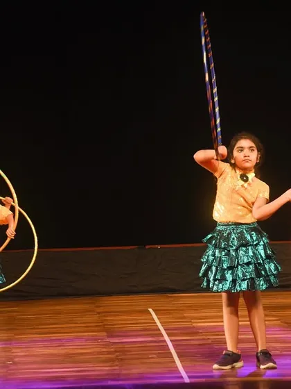 A display of skill and confidence as our young performers manipulate multiple hoops during their act.