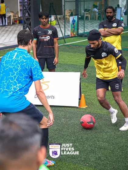 A one-on-one situation on the pitch, showcasing individual skill and strategy. Our tournaments provide a platform for standout players to shine.