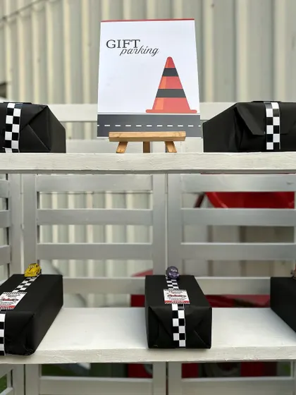 "Gift Parking" is a clever and cute detail for a race car party. It's these small touches that make our themed parties so memorable.