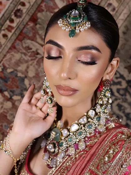 This shot showcases the flawless blending of the eyeshadow and the soft, matte finish of the lips.