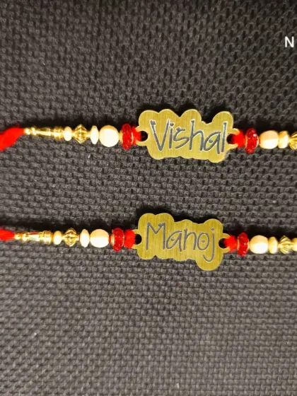 Custom rakhis with names cut out from metal, offering a unique and modern twist on the traditional name rakhi.