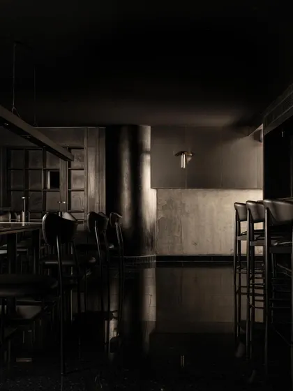 A collection of atmospheric shots from Lair, showcasing the interplay of black concrete, glass blocks, polished steel, and dramatic lighting. Each image captures a fragment of the bar's mysterious and immersive character.