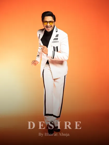 A dynamic pose in the white and black striped co-ord set, showing how it moves with the wearer.