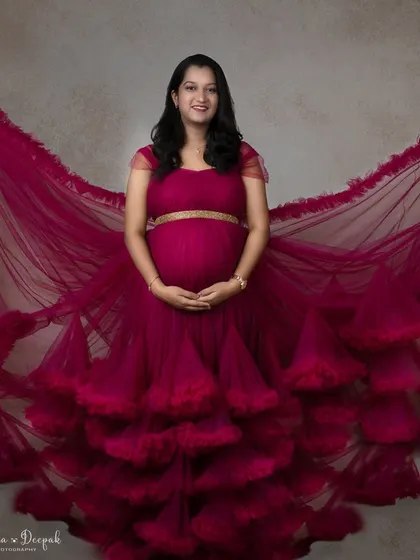 The full spread of this incredible magenta gown. The way the fabric fans out creates a breathtaking effect that is pure art.