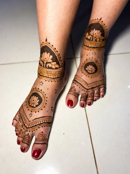 A beautiful lotus-themed design for the feet, with bold motifs on the ankle and a matching design on the top of the foot.