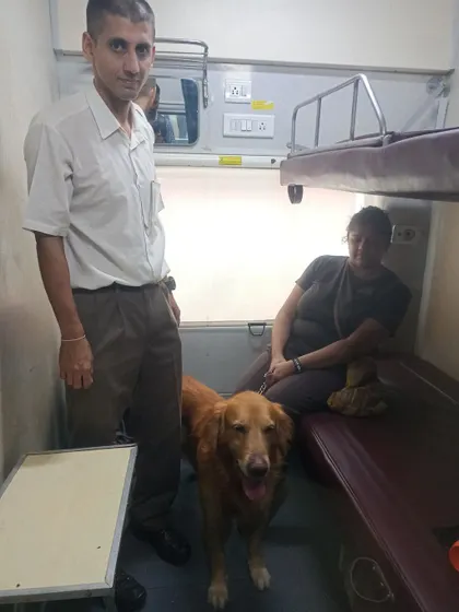 A pet parent with his Golden Retriever, Hobbes, in their train coupe during their relocation from Delhi to Dibrugarh, a journey I was proud to facilitate.