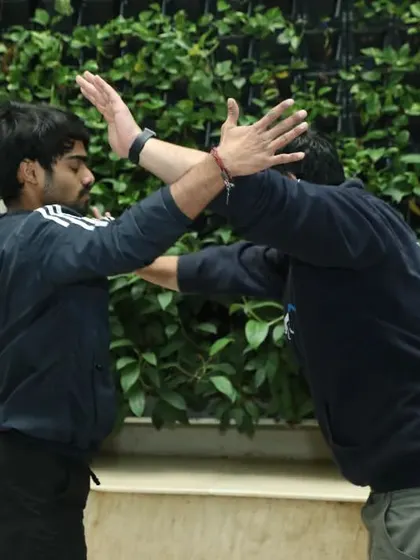This shows a blocking and trapping drill. The goal of Krav Maga is to end the fight quickly. By controlling the attacker's arms, you prevent them from launching further attacks while you create an opening for your own.