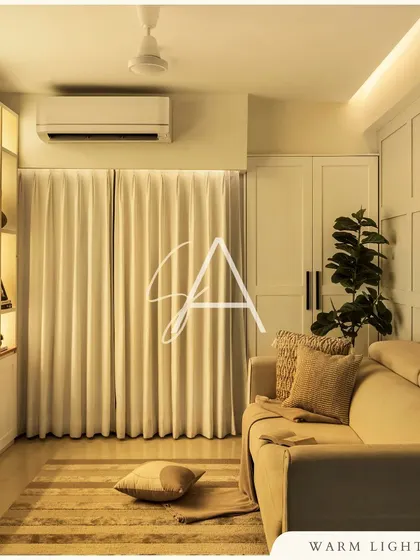 Warm, indirect lighting is essential for creating a cozy atmosphere. In this living room, I used concealed LED strips and backlit shelving to cast a soft glow, making the space feel inviting in the evening.