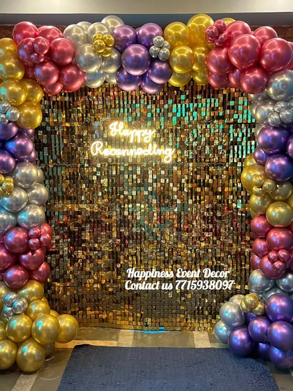 My sequin backdrops are available for rent and can make any event glamorous. This setup shows a golden sequin wall framed by a colorful balloon arch and a 'Happy Reconnecting' neon sign, perfect for corporate events or parties.