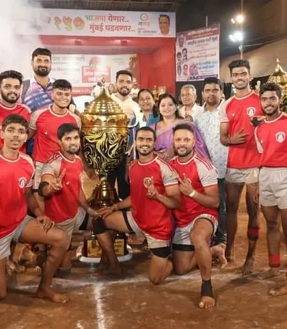 A celebratory shot on the mat with the trophy after winning the final match.
