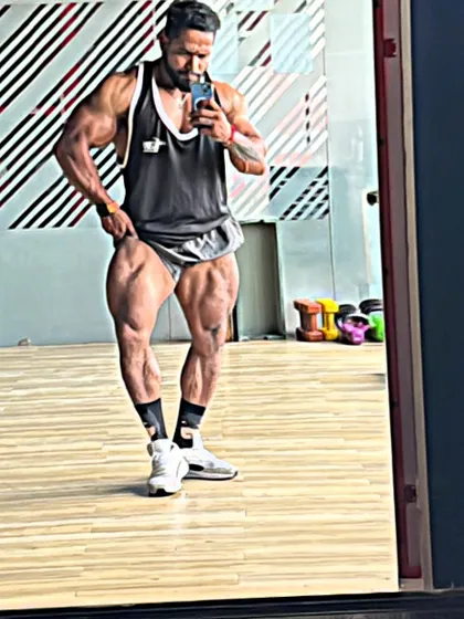 Checking leg development in the mirror. Your muscles only grow with effort.