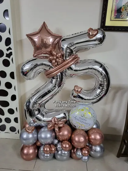 A 25th anniversary balloon bouquet in rose gold and silver.