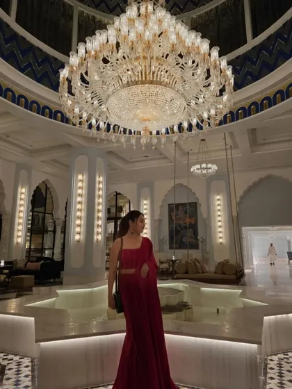 A moment of quiet elegance in a beautiful red saree at the Fairmont hotel in Udaipur. The grandeur of the location called for an equally grand and classic outfit.