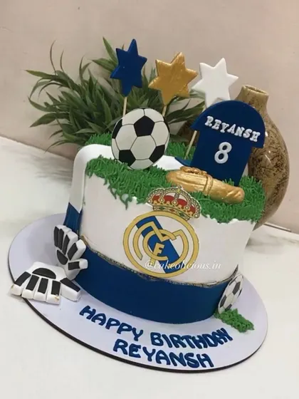 A side view of the football-themed cake, showing the detailed elements that bring the theme to life.