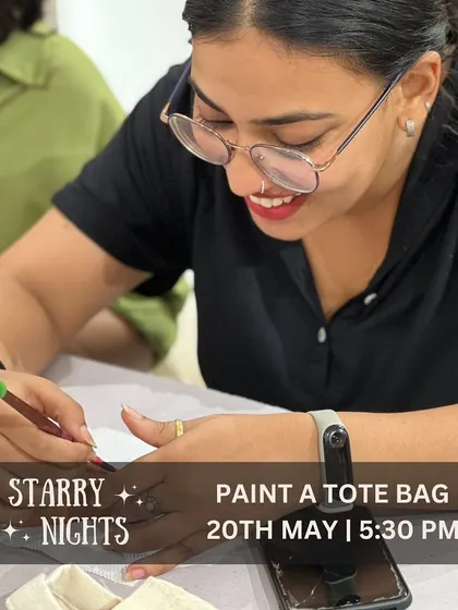 A guest smiles as she adds the finishing touches to her tote bag design. Our workshops provide a relaxed and friendly environment where you can express your creativity and have fun.