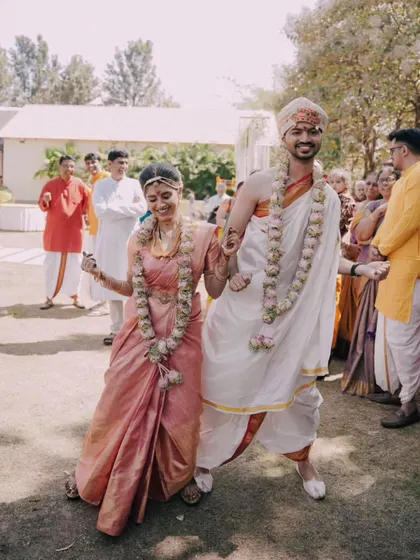 A playful, dancing exit from the ceremony, showing the couple's fun-loving personalities.