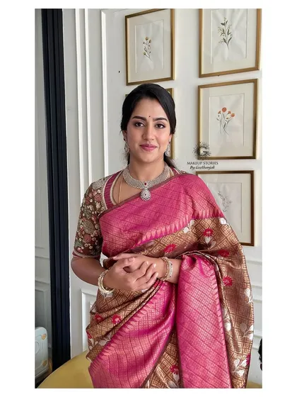 A smiling portrait of Revathi Nikhil Kumarswamy. Her makeup is fresh and radiant, enhancing her natural beauty with a touch of elegance.