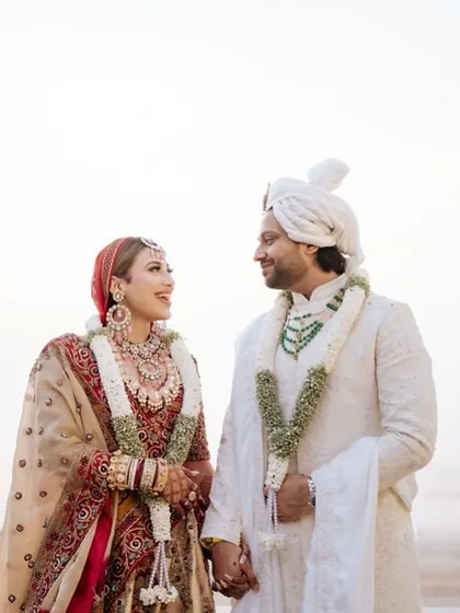 A classic portrait against a serene beach backdrop. We plan destination weddings that offer stunning natural scenery for your couple photoshoots.