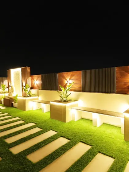 The illuminated pathway and built-in seating in the Sushant Lok terrace garden. The planters also have integrated lighting.