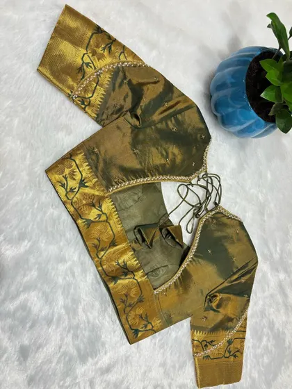Where tradition meets tasteful. This blouse whispers elegance, it doesn't scream it.