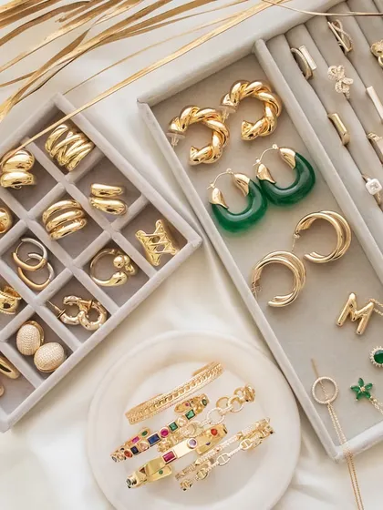 Upgrade your look with these must-have pieces. This flatlay showcases some of my favourite chunky rings, twisted hoops, and colourful cuff bangles.