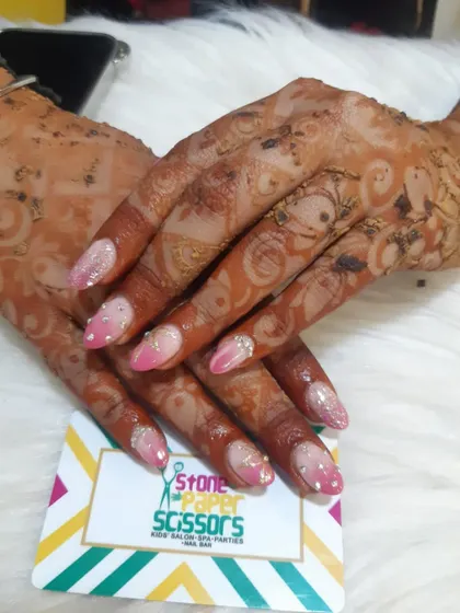 Getting ready for a party with some festive henna. This design is a bit lighter and perfect for when you want beautiful mehendi that complements your overall look, including your nails.