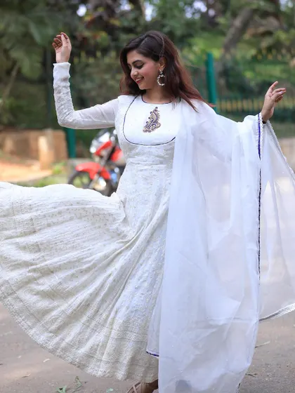 The joy of wearing an outfit that makes you feel beautiful. This white Anarkali is all about effortless elegance and grace.