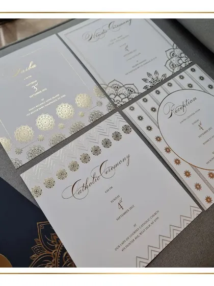 We love working with the timeless combination of white, gold, and navy blue. This suite uses mandala-inspired patterns with gold foil stamping to create a look that is both elegant and rooted in Indian design traditions.