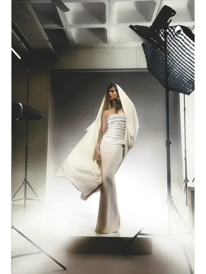 A behind-the-scenes look at a studio shoot, showing the full setup with a model in a white couture gown. This is a typical environment for my fashion photography workshops.
