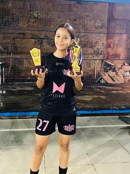 One of our youngest stars shines bright, holding both the winner's trophy and her individual award for being a standout player in the tournament.