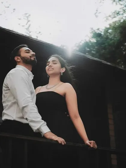 A couple enjoying the sunlight on a rustic balcony. I look for natural light and interesting locations to create pre-wedding photos that feel authentic and beautiful.