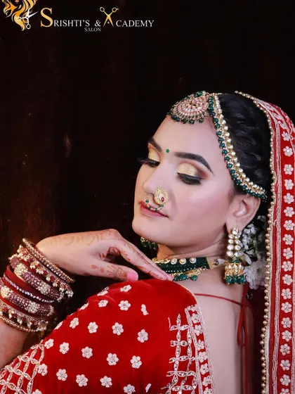 A soft, golden eyeshadow look paired with a classic red lehenga. This combination is perfect for the bride who wants a touch of modern glam with her traditional attire.