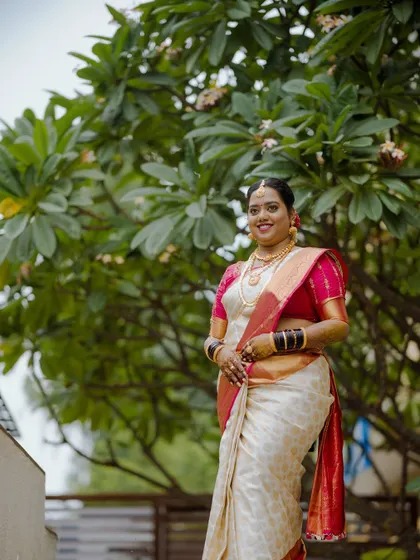 A duplicate of ID 21, this portrait shows a bride on her muhurtham day, smiling warmly.