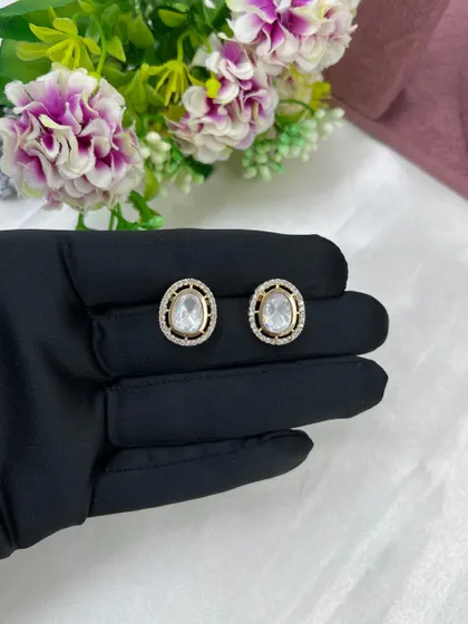 The Saanvi Royal Three-Layer Set. This delicate gold-plated set features three distinct chains with small pendants, offering a trendy, layered look in a single piece.