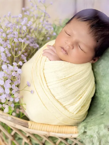 This angle brings the focus back to the baby, capturing their sweet sleeping expression in perfect detail.