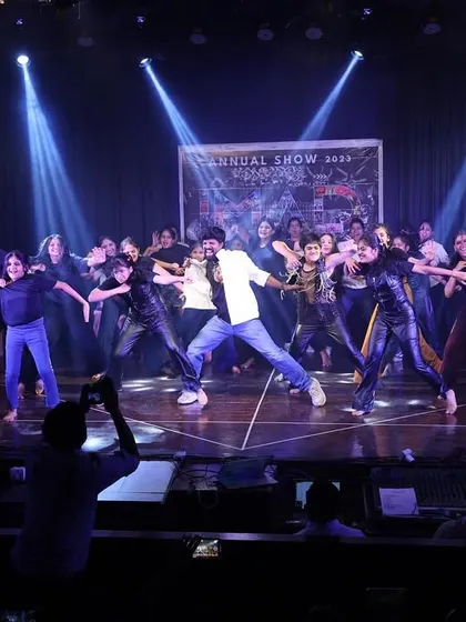 Me joining my students on stage for a powerful group performance, a true highlight of the annual show.