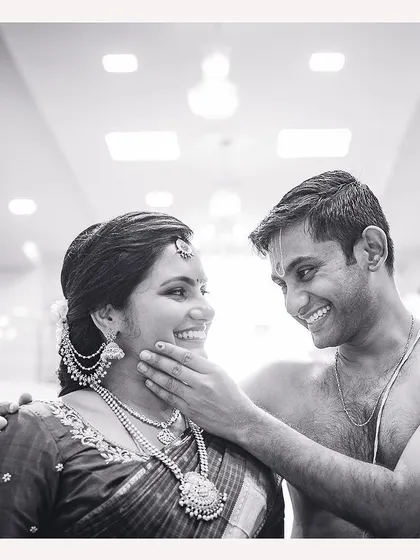 A beautiful black and white portrait of an expecting couple, capturing a quiet, intimate moment during their baby shower.